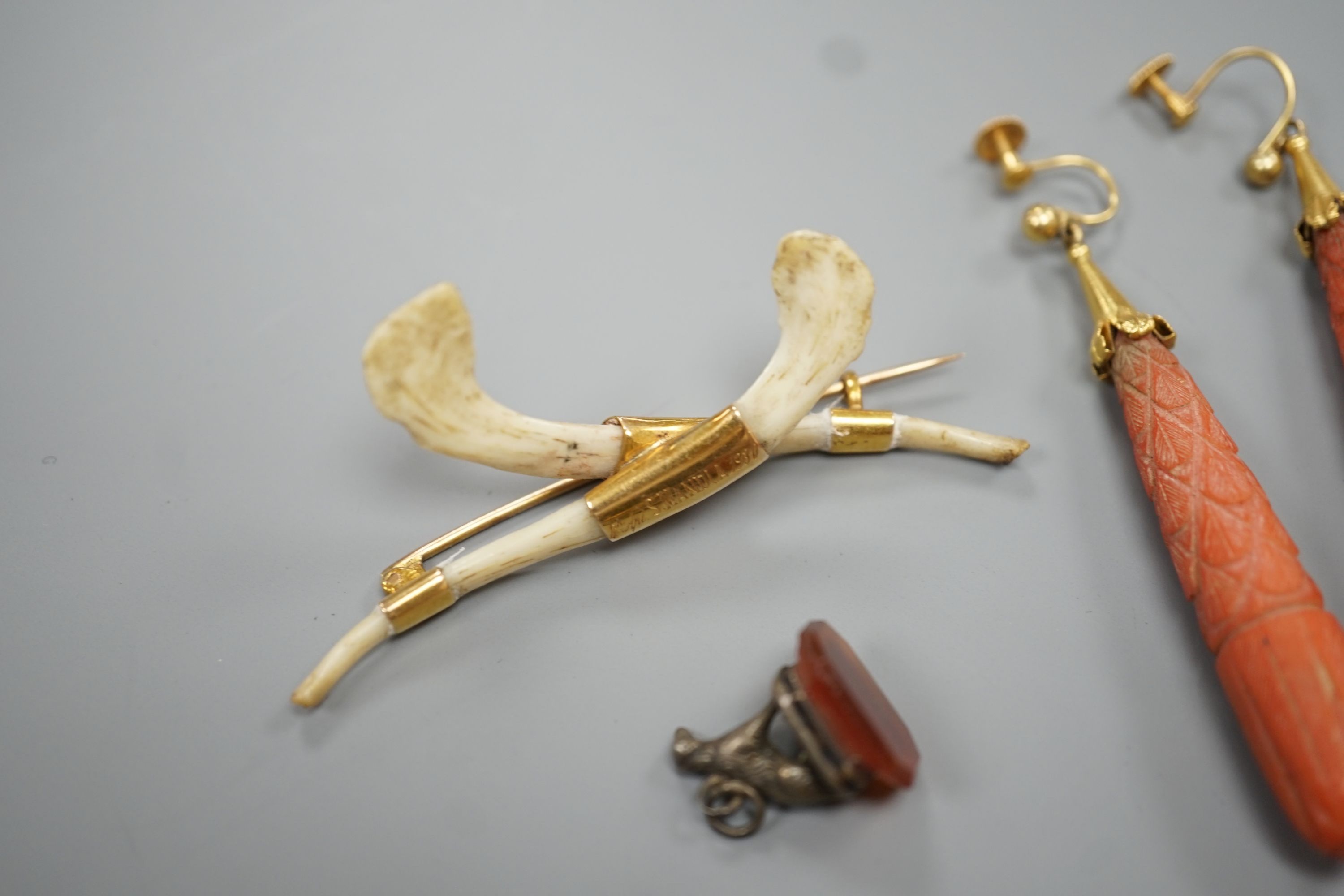 A pair of 9ct mounted teardrop shaped carved coral drop earrings, 6cm, gross 14.7 grams, a carved coral bead bracelet with yellow metal and carved coral bust set clasp, gross 20.5 grams and four other items including a 9